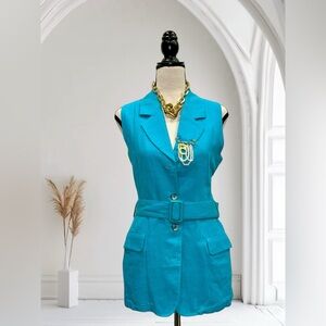 Teal sleeveless blazer dress with belt. Two front pockets. Button closure.